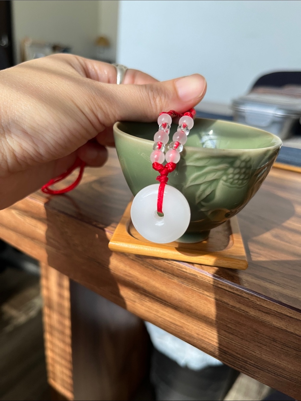 White Jade Donut Pendant on Red Cord Necklace